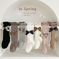 Quần tất đính nơ